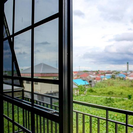 Oyo 90162 Remboelan Guest House Sungai Lutus Exterior photo