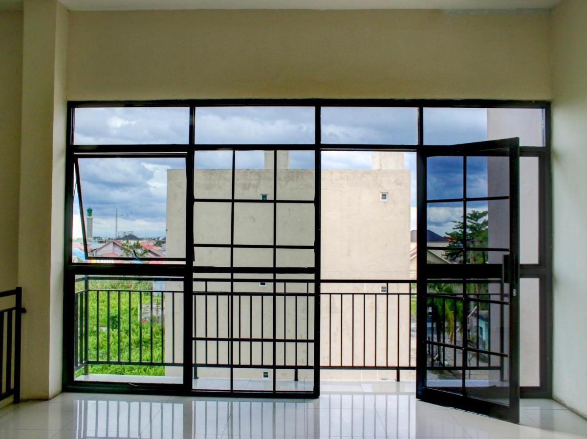 Oyo 90162 Remboelan Guest House Sungai Lutus Exterior photo